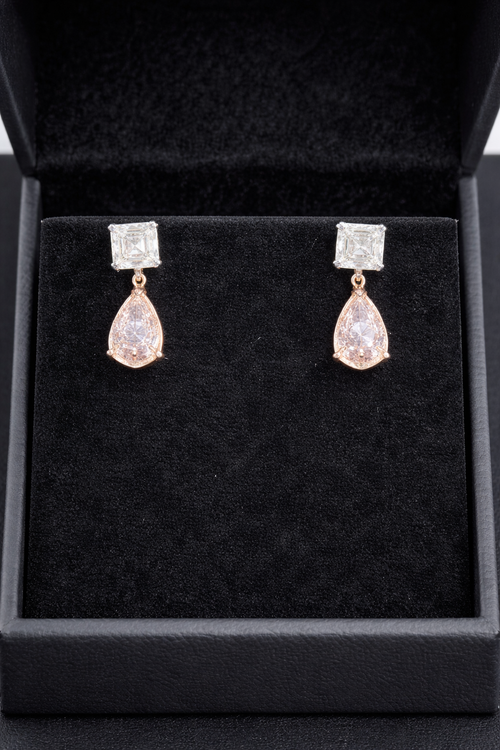 14K white and rose gold fancy pink diamond drop earrings featuring sparkling pink diamonds and elegant design.