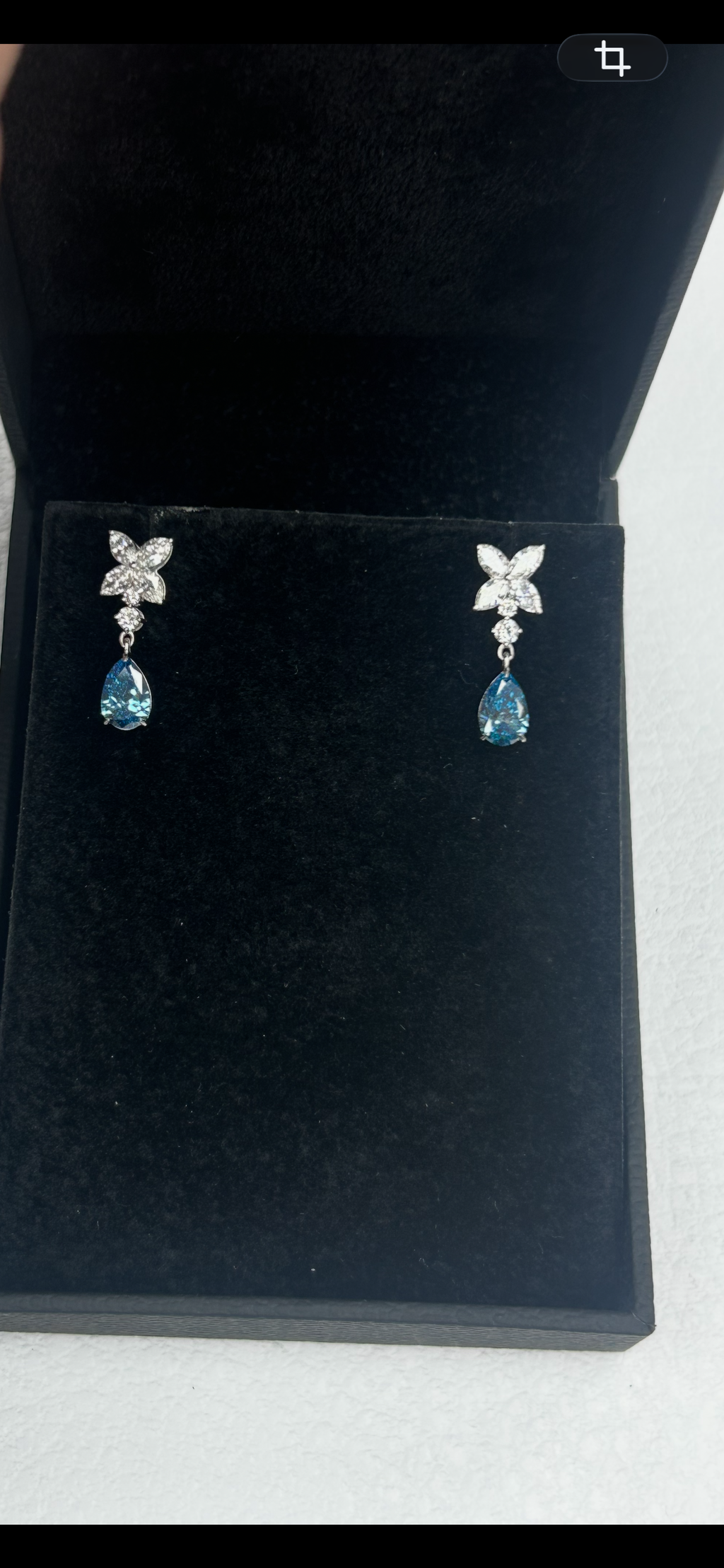 14K white gold diamond drop earrings featuring fancy blue marquise and round diamonds with elegant design.