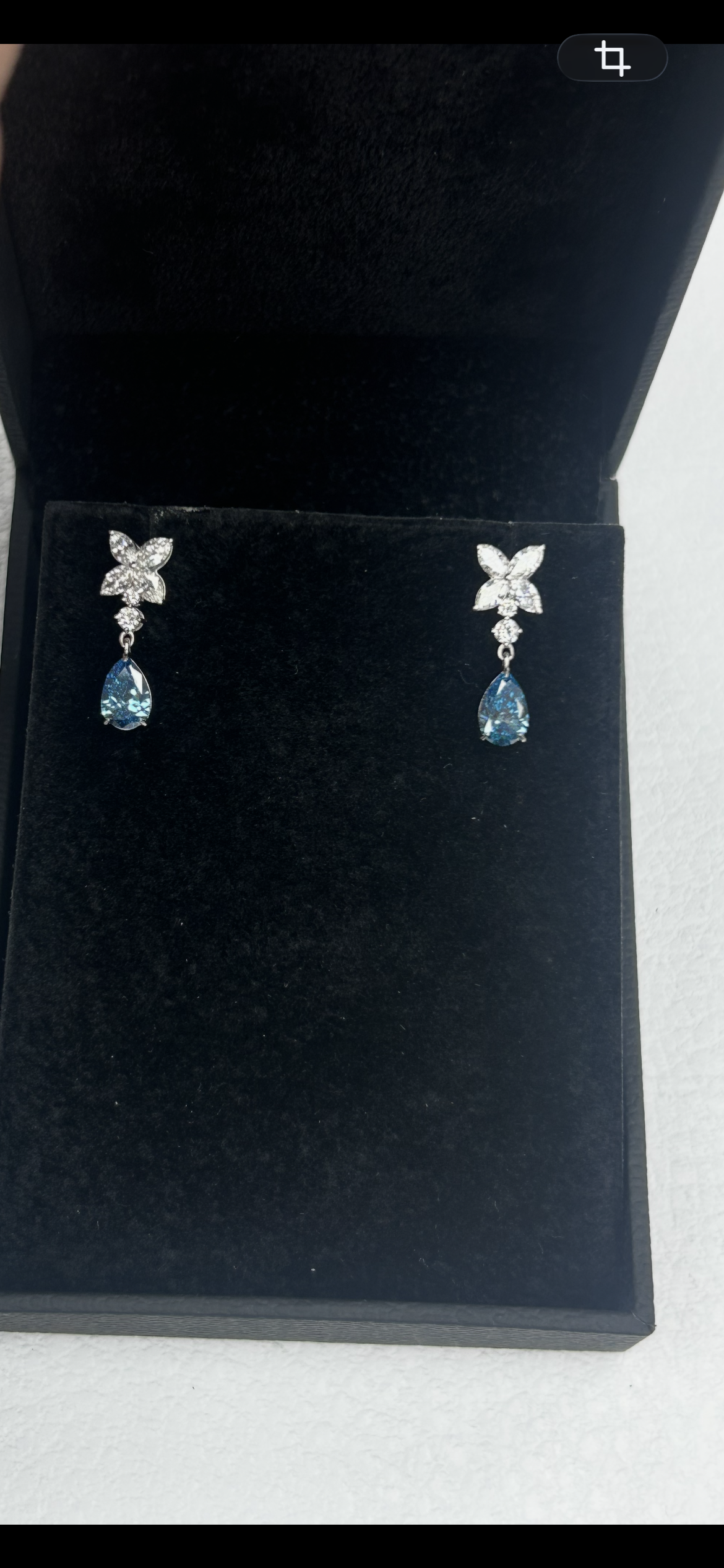 14K white gold diamond drop earrings featuring fancy blue marquise and round diamonds with elegant design.