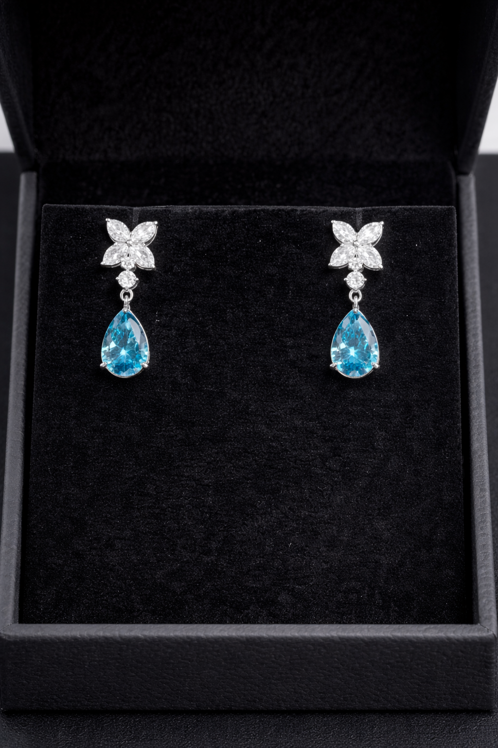 14K white gold fancy blue marquise and round diamond drop earrings with elegant design and sparkling gemstones.