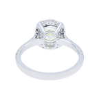 14K white gold fancy yellow cushion diamond halo ring with 1.79 carats, featuring a luxurious yellow center stone and sparkling diamond accents.