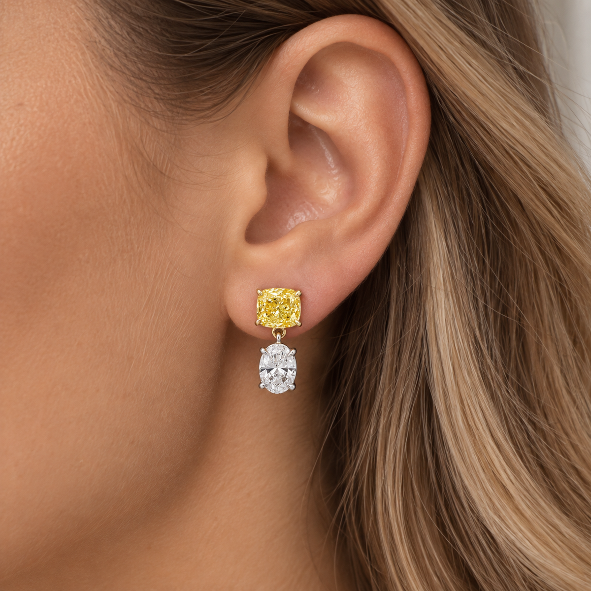 Colorlabdiamonds 14KT two-tone yellow and white cushion and oval drop earrings with 4.61ctw featuring fancy yellow accents.