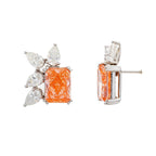 14KT pink gold earrings featuring radiant and pear cut diamonds with fancy pink accents, showcasing elegant jewelry design.