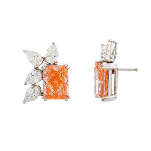 14KT pink gold earrings featuring radiant and pear cut diamonds with fancy pink accents, showcasing elegant jewelry design.