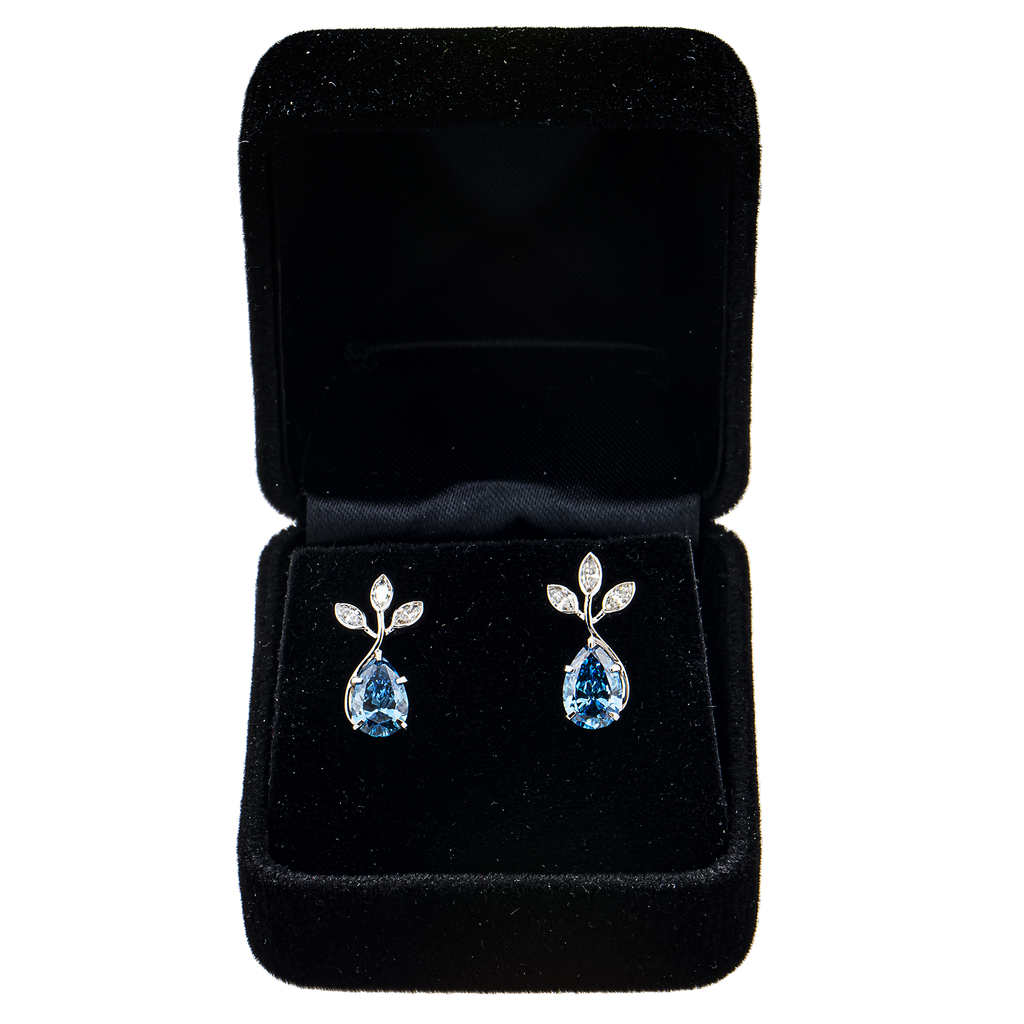 Colorlabdiamonds 18K white gold fancy blue pear cut earrings with 2.43 carat total weight, featuring elegant gemstone design.