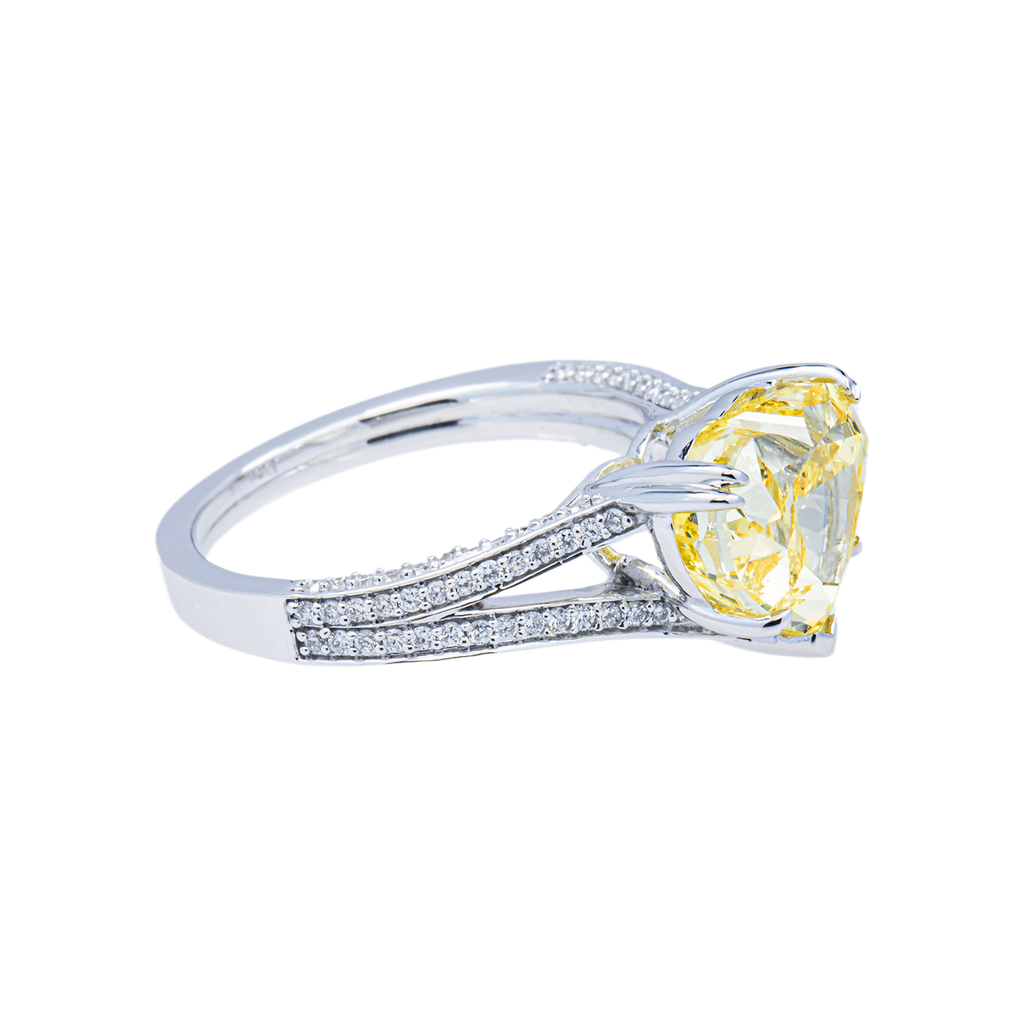 14K white gold fancy yellow heart-shaped diamond ring with IGI 4.59 carat total weight, featuring sparkling diamonds and intricate design.