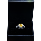 14K white gold fancy yellow heart-shaped diamond ring with IGI 4.59ctw, featuring sparkling yellow diamonds and intricate detailing.
