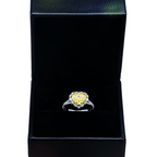 14K white gold ring with a yellow heart-shaped diamond and halo of pave diamonds, 3.69 carats total weight.