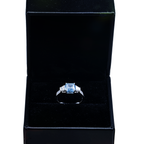 14KT white gold fancy blue Asscher cut diamond ring with intricate design, showcasing a stunning blue gemstone and sparkling accents.