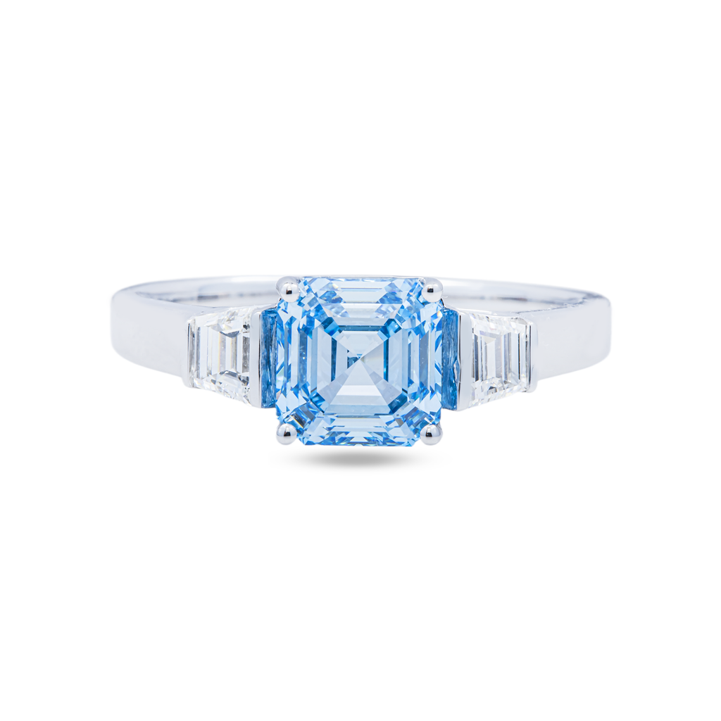 14KT white gold fancy blue Asscher cut diamond ring with intricate design, showcasing the elegant gemstone setting.