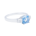 14K white gold fancy blue Asscher cut diamond ring with intricate detailing, featuring a stunning center stone for elegant jewelry.