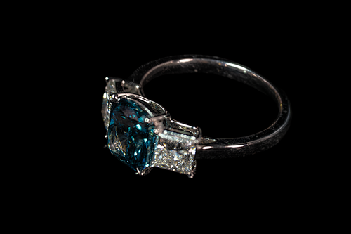 14K white gold fancy blue diamond ring with 3.17 CTW, featuring intricate design and sparkling blue diamonds.