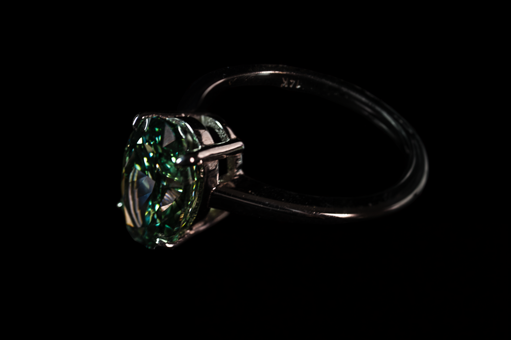 14K white gold fancy green oval solitaire ring with 3.25 carats of sparkling green gemstone from Colorlabdiamonds.