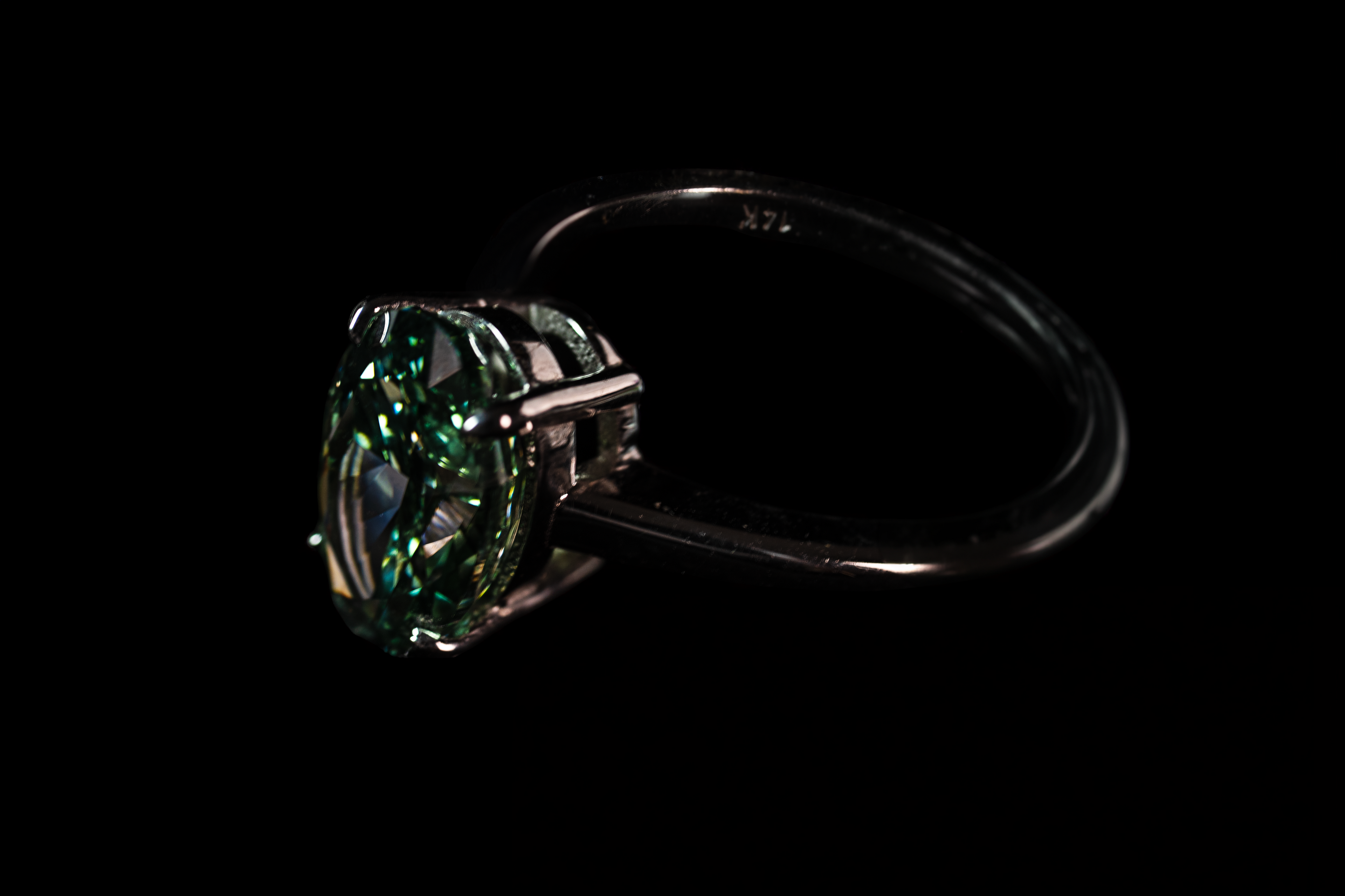 14K white gold fancy green oval solitaire ring with 3.25 carats of sparkling green gemstone from Colorlabdiamonds.