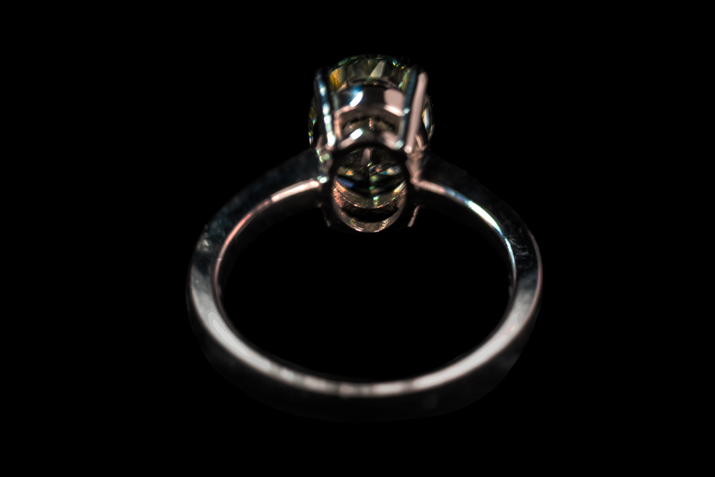 14K white gold fancy green oval solitaire ring with 3.25 carats from Colorlabdiamonds, showcasing a vibrant green gemstone.