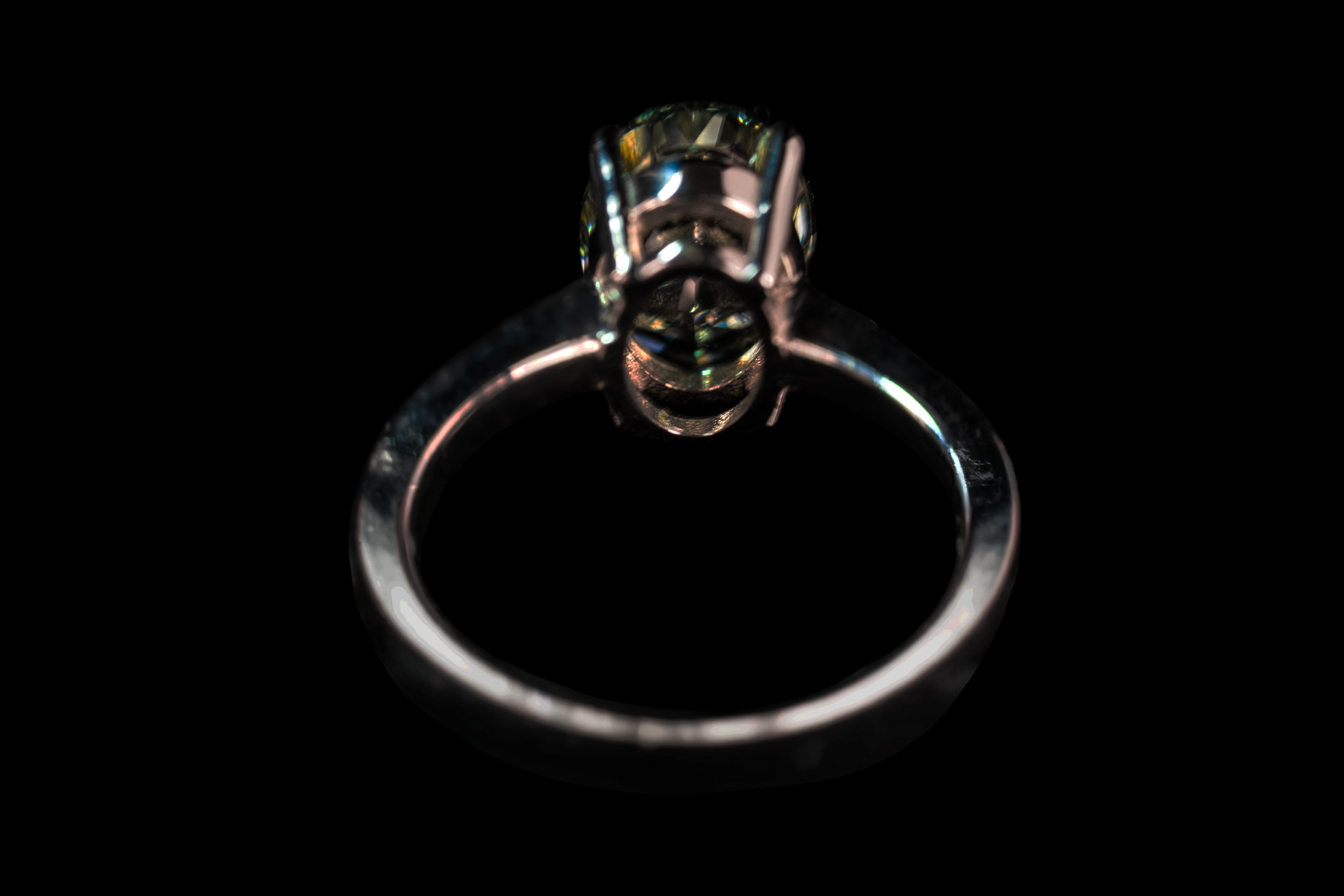 14K white gold fancy green oval solitaire ring with 3.25 carats from Colorlabdiamonds, showcasing a vibrant green gemstone.
