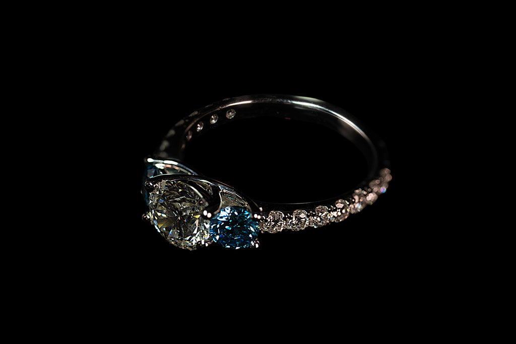14K white gold triple diamond blue ring with 2.31 ctw, featuring elegant blue and white gemstone accents.