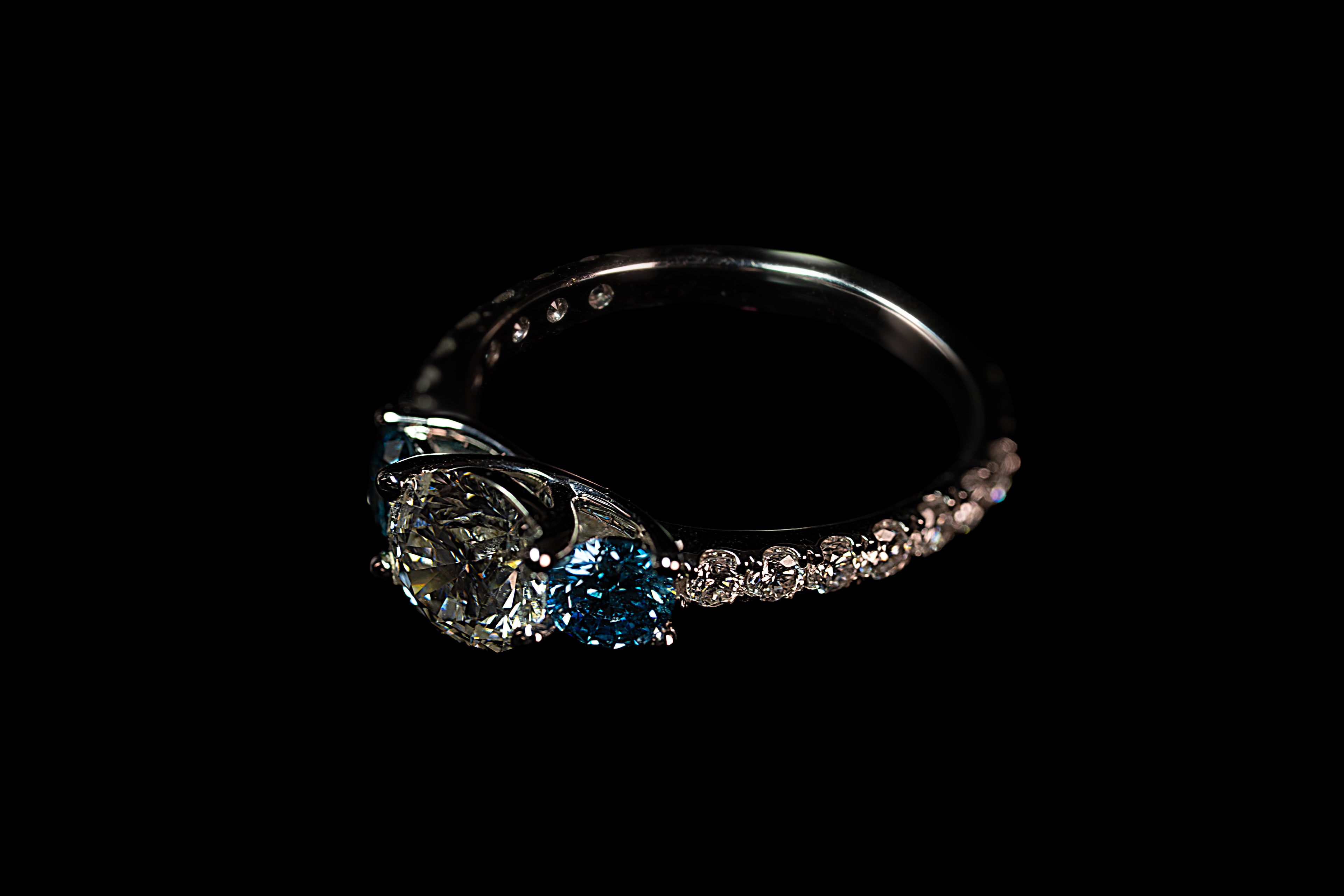 14K white gold triple diamond blue ring with 2.31 ctw, featuring elegant blue and white gemstone accents.